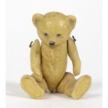 Miniature bisque teddy bear with jointed limbs, 5.5cm high