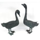 Two bronzed geese, the larger 74cm high