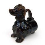 Stoneware pottery flask in the form of a dog, 18cm high