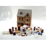 Large dolls' house with balcony and fitted interior with accessories and furniture, wired for