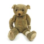 Large straw filled teddy bear with beaded glass eyes, 70cm high
