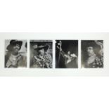 Four Jimi Hendrix black and white publicity photographs, each 25cm x 21cm