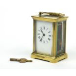 French brass cased carriage clock with enamel dial and swing handle, 12cm high