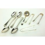 Georgian silver flatware including four tablespoons, two pairs of sugar tongs and a sifting spoon,