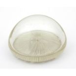 Victorian hollow clear glass paperweight with white stylised bottom, 10cm diameter