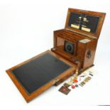 Edwardian brass bound stationery box fitted with two cut glass ink bottles and an assortment of