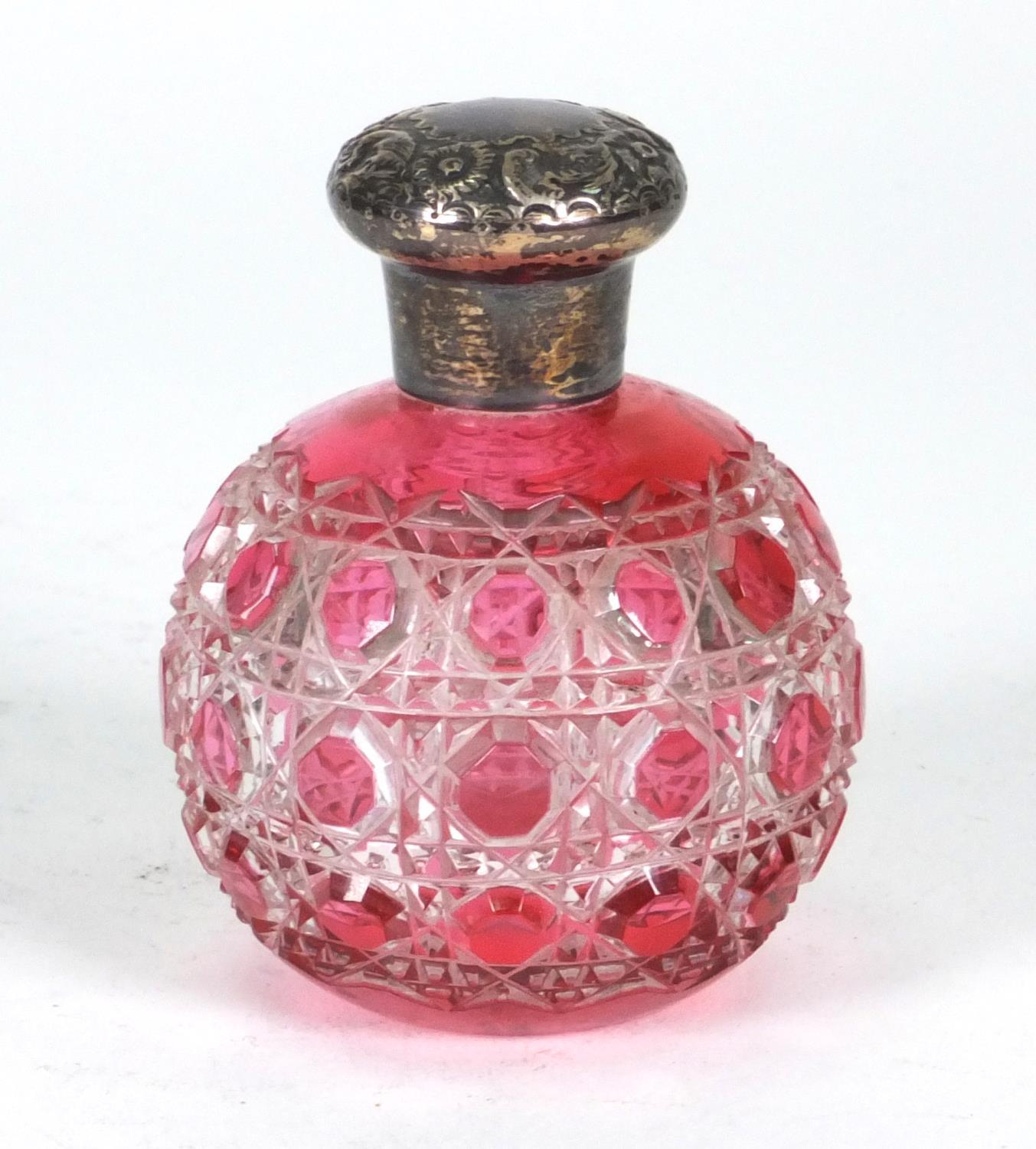 Cranberry cut glass scent bottle with silver lid, hallmarked R&B Sheffield 1901, 7.5cm high