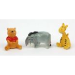 Three Beswick Winnie the Pooh figures comprising Winnie the Pooh, Eyeore and a giraffe, the