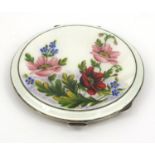 Lady's silver floral enamelled compact dated H.C.D Birmingham 1958, 7.5cm diameter Generally good