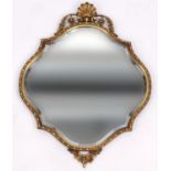 Ornate gilt framed shaped bevel edged mirror with shell crest, 77cm high