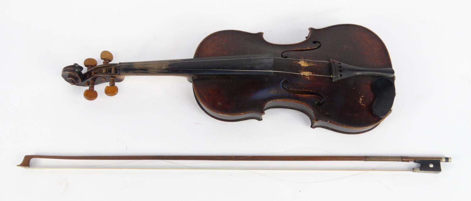 Old wooden violin and a bow with mother of pearl frog, the violin 59cm long
