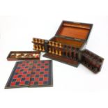 Victorian coromandel games box with wooden chess pieces and draughts, 33cm diameter