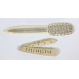 Pierced ivory letter opener and a folding carved and pierced bone penknife, the larger 23cm long