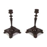 Pair of cast iron Max Hartmann pierced Arts and Crafts candlesticks Both of the bases are slightly