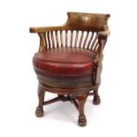 Mahogany swivel captain's chair with red leather seat