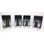 Four boxed sets of two Stuart Crystal champagne flutes, each 19cm high