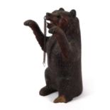 Black Forest carved wooden standing bear with beaded glass eyes, 30cm high