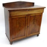 Victorian mahogany chiffonier with a drawer above two panelled doors, 107cm high x 103cm wide x 51cm