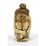 Oriental scent bottle in the form of a seated nude female, 6.5cm tall