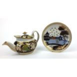 Newhall porcelain teapot and cover decorated with vine design, together with a Newhall elephant