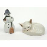 Two Royal Copenhagen models - one of a snowman and one of a cat sleeping, the larger 13cm high