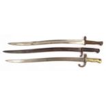 Three military interest long bayonets including a French example, all stamped, the example with