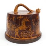 Sheed Studio Pottery cheese dome decorated with horses, figures and flowers, on a wooden base,