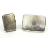 Two silver cigarette cases including a curved example, the larger 8.5cm high