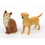 Beswick Labrador and a Beswick ginger cat, the cat 16cm high Both are in generally good condition,