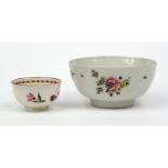 Bristol porcelain slop bowl and a tea bowl hand painted with flowers, the larger 14cm diameter The