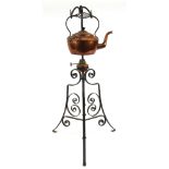 Christopher Dresser style Arts and Crafts copper kettle on a wrought iron stand, registered trade