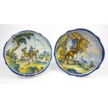 Two Italian Maiolica pottery chargers, both decorated with figures of warriors on horseback, each