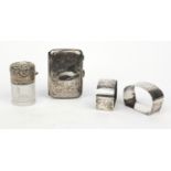 Group of silver items comprising pair of silver napkin rings, lady's silver cigarette case and a