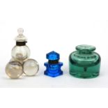 Victorian green glass inkwell, together with a blue glass lidded inkwell and a novelty iridescent
