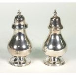 Pair of silver baluster shaped sifters, HA Sheffield 1899, 11cm high