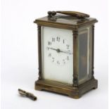 French brass cased carriage clock with enamel dial and swing handle, 12cm high