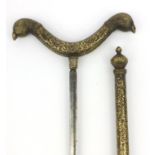 Middle Eastern brass floral chased sword stick with double ended bird finials, 58cm long