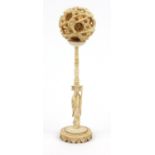 Oriental Chinese carved ivory puzzle ball on stand, 16cm high