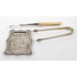 Silver Punch pin tray, pair of Georgian silver sugar tongs and a silver and ivory cheese scoop,