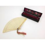 Oriental Chinese ivory fan carved and pierced with figures, housed in a fitted wooden box, 21cm long