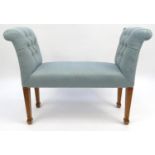 Oak framed window seat with pale blue button upholstery