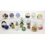 Group of colourful glass paperweights including Selkirk, Langham, Isle of Wight and Caithness