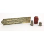 Ivory ruler, together with a bone barrel shaped thimble case housing two silver coloured metal