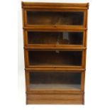 Walnut four tier Globe Wernicke bookcase, 147cm high x 86cm wide x 30cm deep