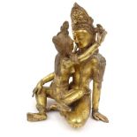 Oriental Chinese gilt bronze Tibetan Buddha of entwined lovers, 27cm high