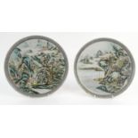 Pair of oriental Chinese porcelain plates hand painted with landscape and figures, character mark to