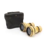 Cased pair of ivory and brass opera glasses, 8cm high