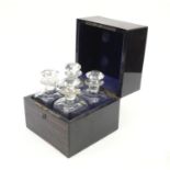 Good quality Victorian coromandel decanter box with Brahmer lock, housing four cut glass