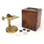 Negretti & Zambra of London brass adjustable microscope with lenses, housed in a fitted mahogany