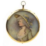 Circular portrait miniature of a lady wearing a wide brimmed hat onto ivory, housed in a gold